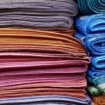 What is Fabric selection in apparel manufacturing?